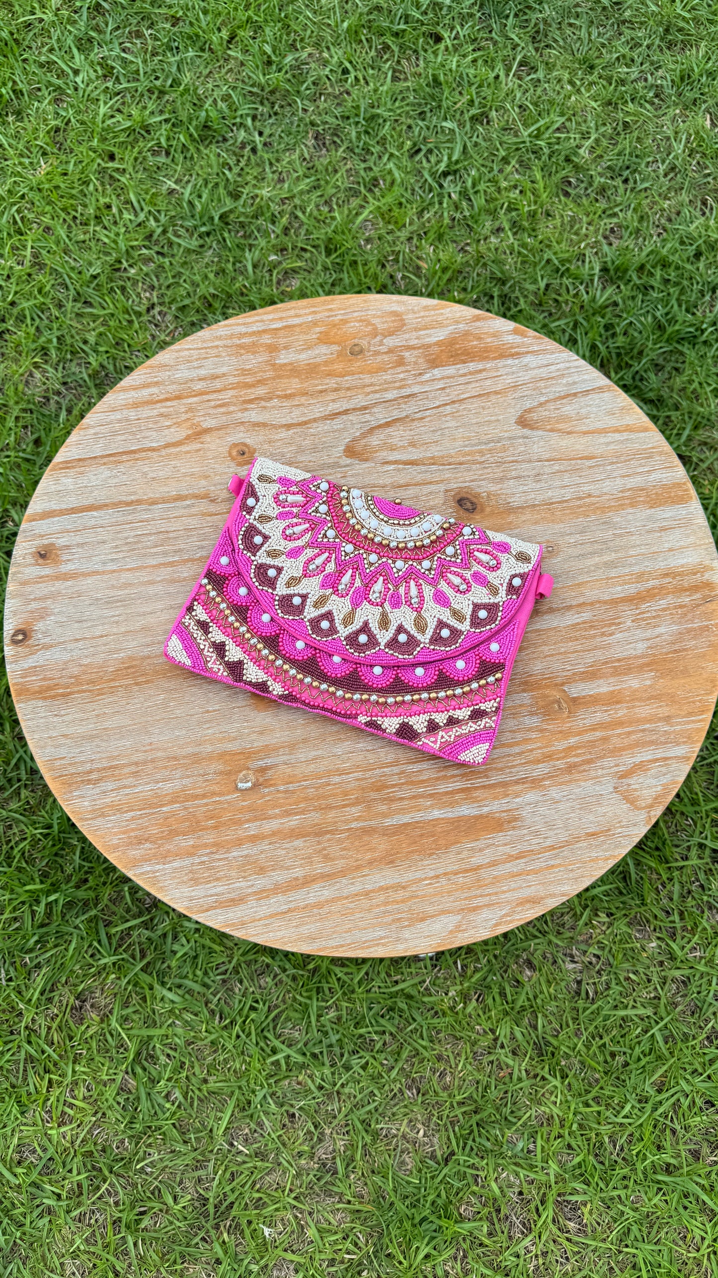 B. Pink Beaded Clutch